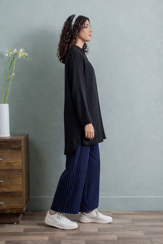 Effortless Elegance in Blue Tunic and Striped Trousers