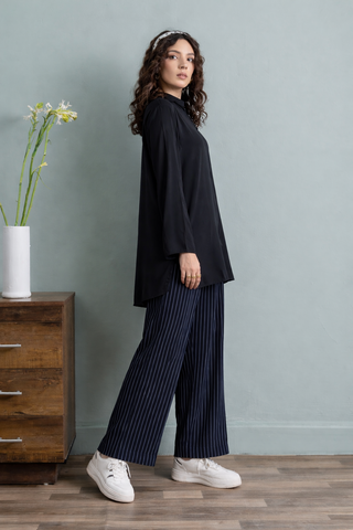 Effortless Elegance in Blue Tunic and Striped Trousers